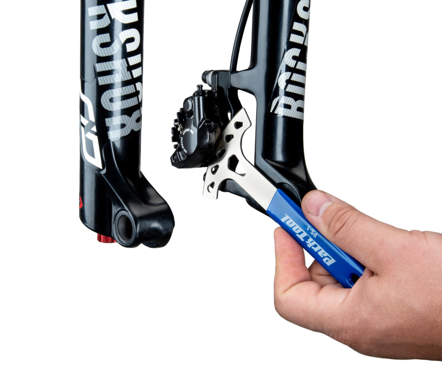 Park Tool PS-1 inséré dans un étrier de frein